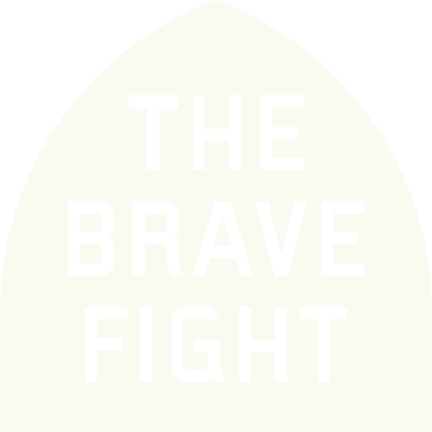 cream shield that says the brave fight