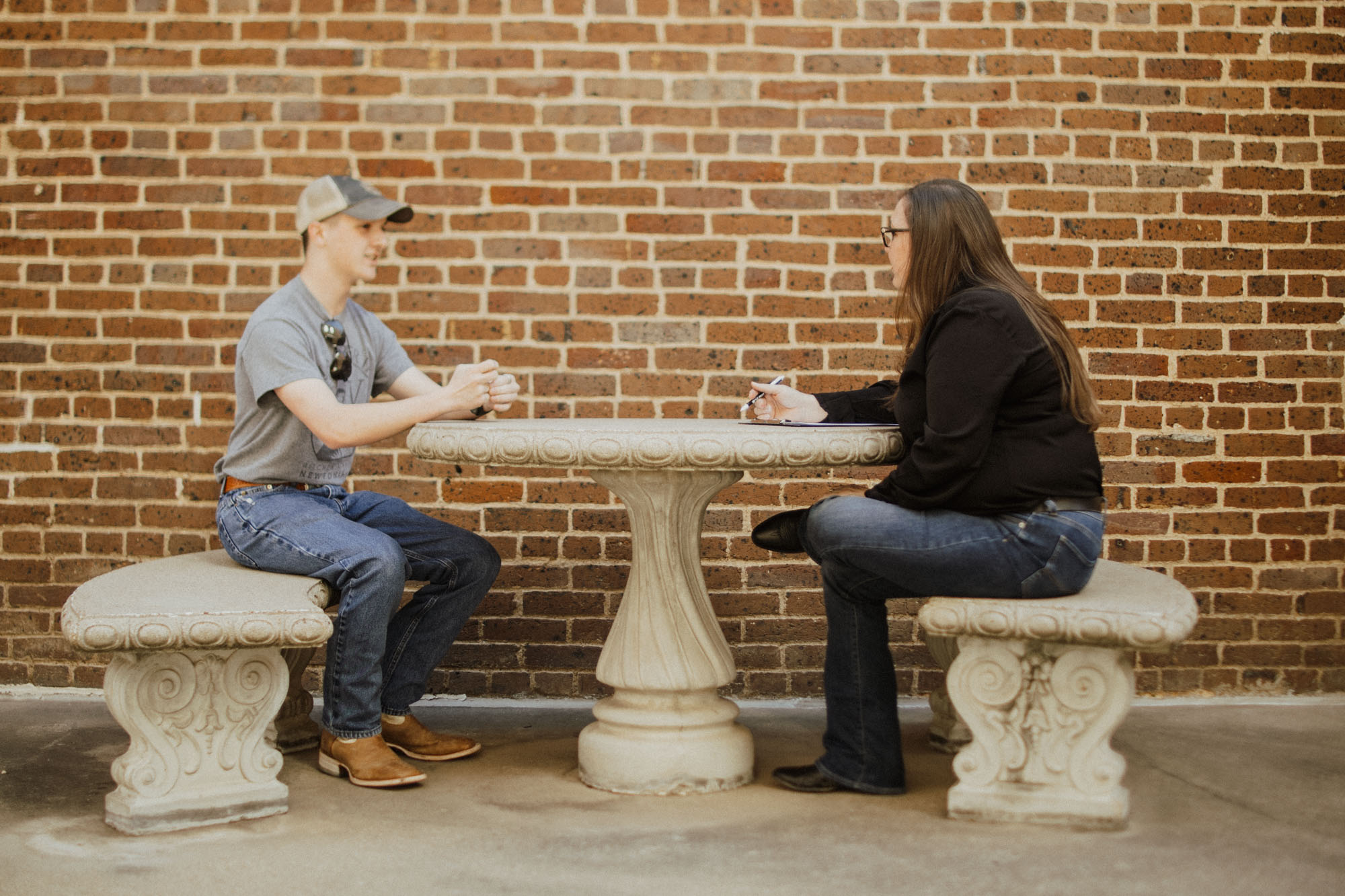 patient in conversation with therapist sitting outside